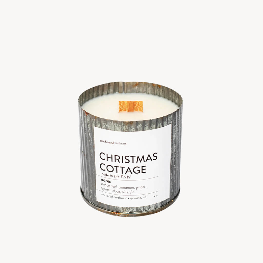 Christmas Cottage Wood Wick Rustic Farmhouse Soy Candle  Notes:  Orange Peel, Cinnamon, Ginger, Cypress, Clove, Pine, Fir  Ingredients: 10 ounces poured in a Rustic Vintage container Untreated Cedar Wood Wick 100% Soy Wax grown in the US.