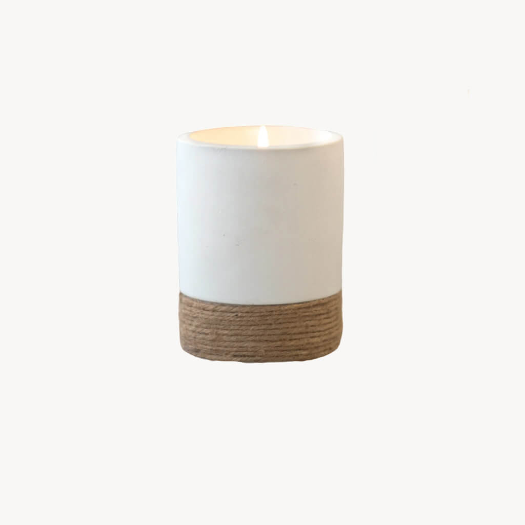 You'll love the simplicity of the modern, yet rustic look our Rylee Round Citronella Candles will add to your outdoor living space! These cylinder-shaped outdoor citronella candles come in a matte ceramic vessel in either grey, black, or white featuring a wrapped twine accent around the bottom of the candle.